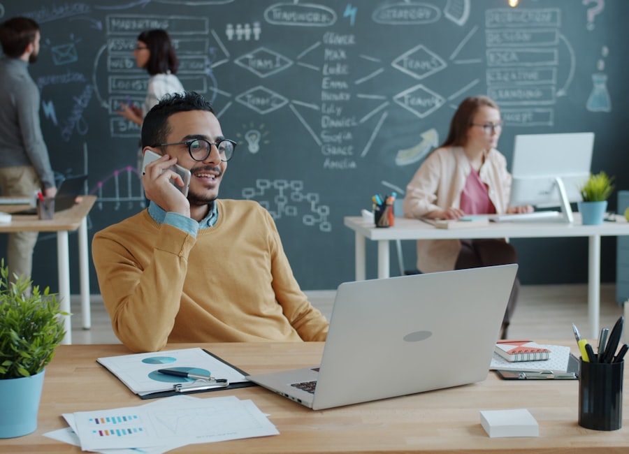 Team collaborating in a modern office with IT planning diagrams